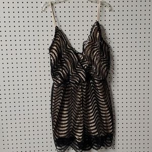 Romper with black sequins.